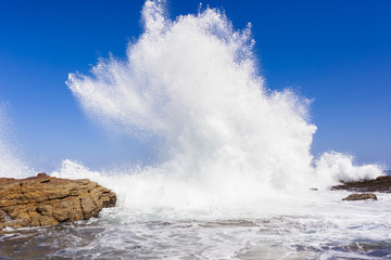Wave Exploding Water power along rocky coastline