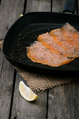Salmon in frying pan.