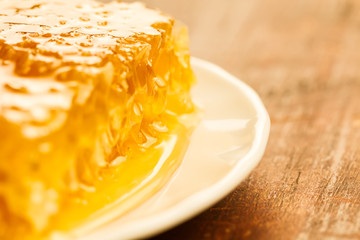 fresh honey on wooden background. Autumn style, honeycomb