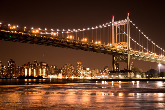 Beautiful view of the Ed Koch Queensboro Bridge in New York City looking towards Manhattan at night