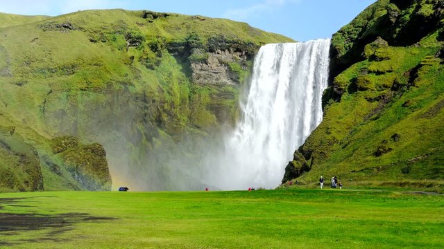 Stop motion time lapse of the Skogafoss waterfall in Iceland with tourists.