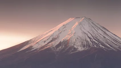 Photo sur Plexiglas Mont Fuji Top of Mt. Fuji with snow before sunrise in winter season