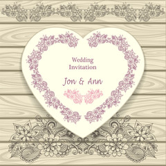 Wedding invitation in heart form  with doodle floral elements