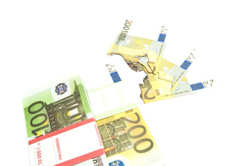 pack of euros and burned banknotes