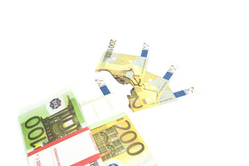 pack of euros and burned bills
