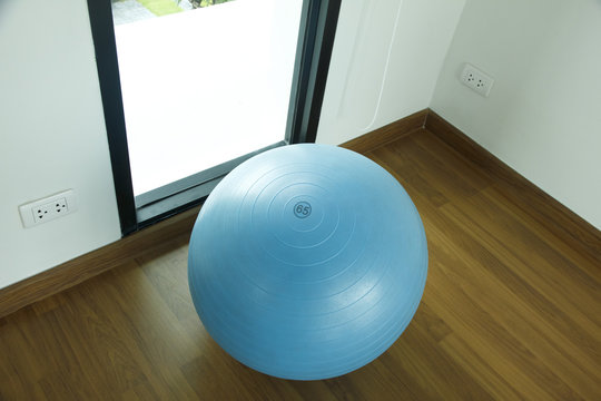 Stock Photo:.exercise ball for fitness on wooden floor