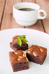 brownies with cup of coffee on table