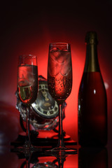 champagne glasses and bottle with clock
