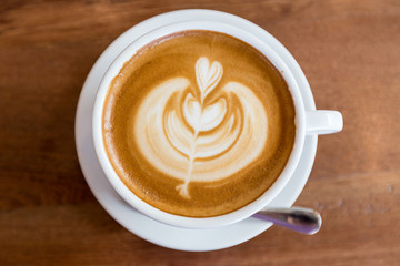 art latte coffee on white cup