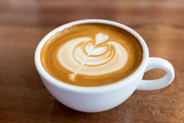 art latte coffee on white cup