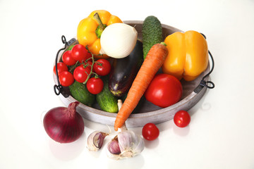 Fresh autumn vegetables on a white background