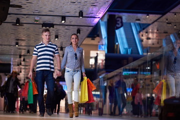 young couple with shipping bags