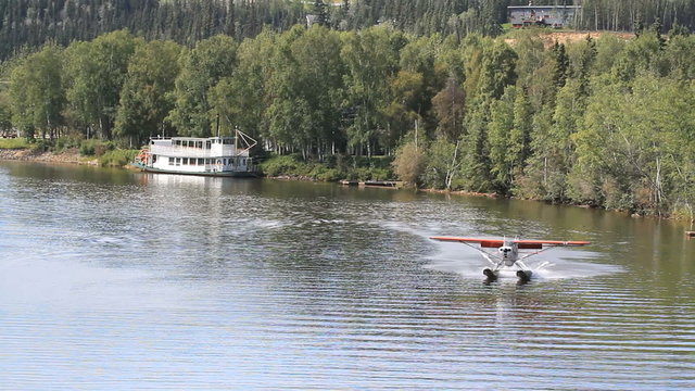 Float plane landing by river boat fairbanks Alaska P HD 1473