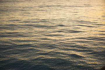 gold water surface at the sunset time