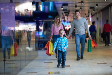 young family with shopping bags