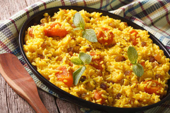Vegetarian pilaf with saffron and dried fruit close up. horizontal
