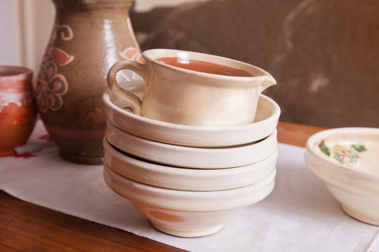 Ceramic plates and a pitcher