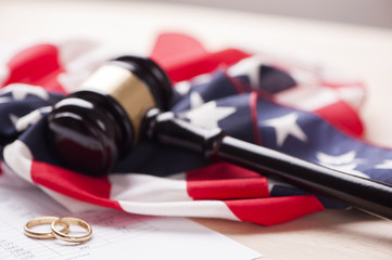 Gavel and wedding rings for divorce concept