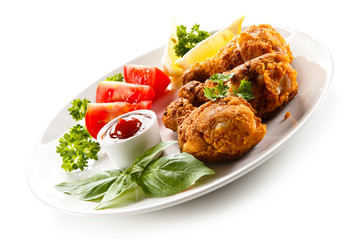 Roasted chicken drumsticks and vegetables 