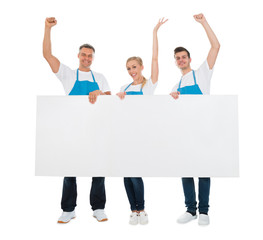 Cleaners Cheering While Holding Banner