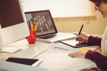 Graphic designer working at desk