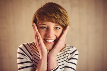 Fototapeta premium Young smiling woman smiling at camera