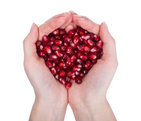 garnet, grains, pomegranate seeds  in female hands.