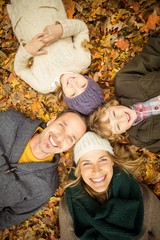 Smiling young family doing a head circles