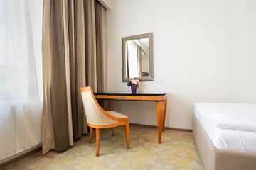 Interior of a classic styled apartment with wooden furniture