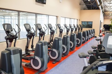 Fototapeta premium Collection of exercise bikes in a row