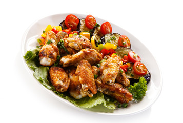 Grilled chicken wings and vegetables