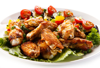 Grilled chicken wings and vegetables