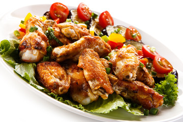 Grilled chicken wings and vegetables