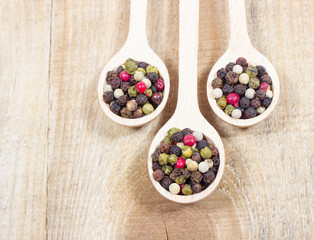 Color pepper on a wooden background.