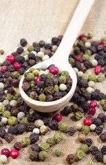 Color pepper on a wooden background.
