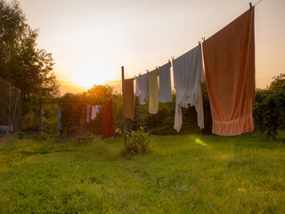 White laundry is drying outside