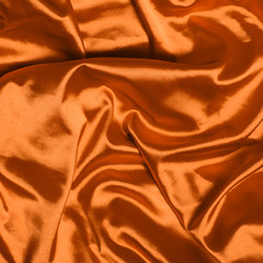 Smooth elegant orange silk background