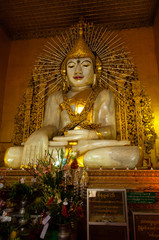Obraz premium Sitting Marble Buddha in temple Mandalay Burma