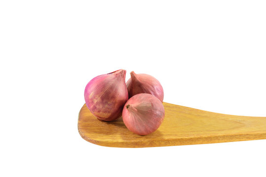 Shallot or Onions on wooden spoon