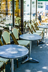Street view of a coffee terrace with tables and chairs,paris Fra