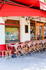 Street view of a coffee terrace with tables and chairs,paris Fra
