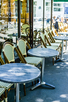 Street view of a coffee terrace with tables and chairs,paris Fra