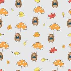 Vector autumn seamless pattern with cartoon hedgehogs and umbrellas.