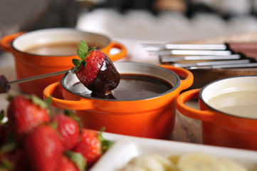 Fondue with strawberry, fruit and hot chocolate