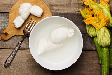 genuine food products: fresh mozzarella and little zucchini with