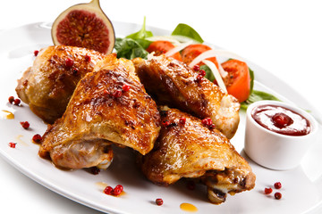 Roasted chicken drumsticks and vegetables