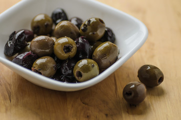 Mixed olives in white bowl