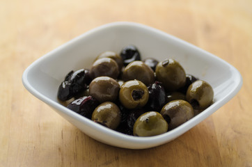 Mixed olives in white bowl