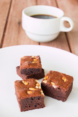 brownies with cup of coffee on table