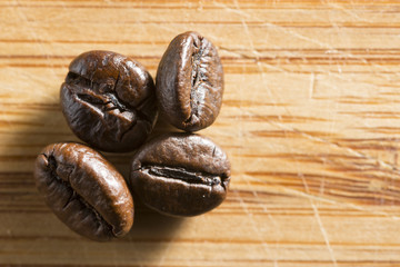 roasted coffee on a bamboo board.
